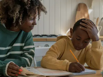 Parent helping child with homework