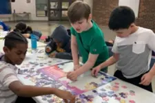 kids working on a puzzle together