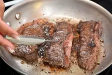 steak in a frying pan