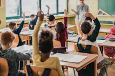 Students raising their hands