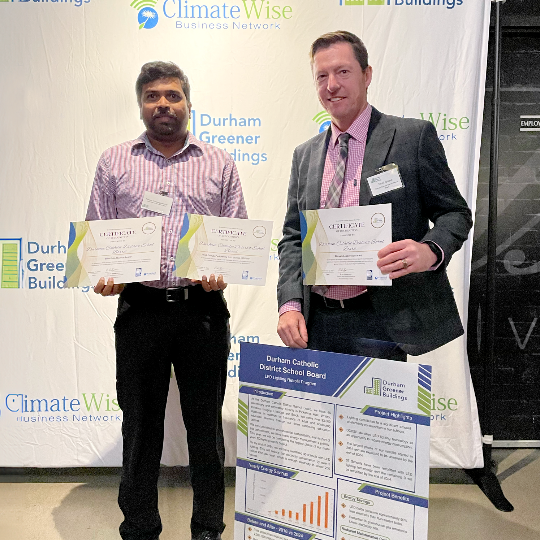 staff members holding awards