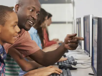 Parent using a computer with a child