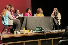 a panel of women on stage